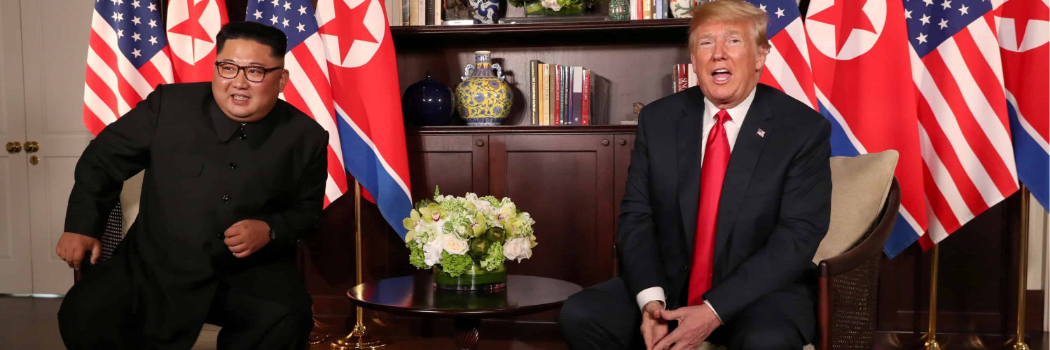 U.S. President Donald Trump sits next to North Korea's leader Kim Jong Un before their bilateral meeting at the Capella Hotel on Sentosa island in Singapore June 12, 2018. REUTERS/Jonathan Ernst TPX IMAGES OF THE DAY - RC1D123560A0